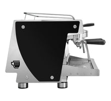 Load image into Gallery viewer, A professional espresso machine with a black and brushed silver aluminum body, featuring a large black side panel, a silver portafilter, and a drip tray, shown against a white background.